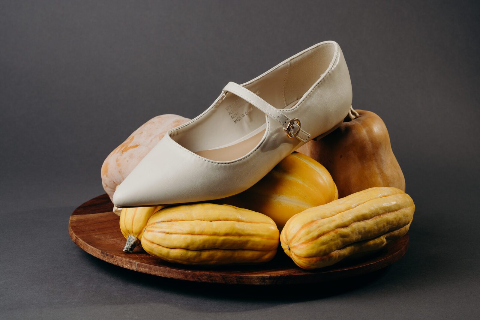 Cream Mary Jane flat on a plate of squash